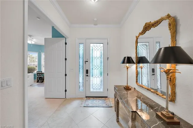 a view of a workspace with furniture and window