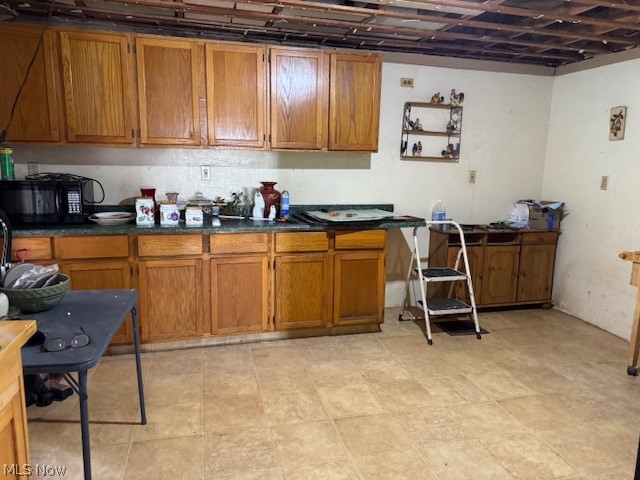 626 High Street Wellsburg, WV 26070 - Photo 18 of 18 Kitchen with wood finish cabinets, black microwave, and dark countertops