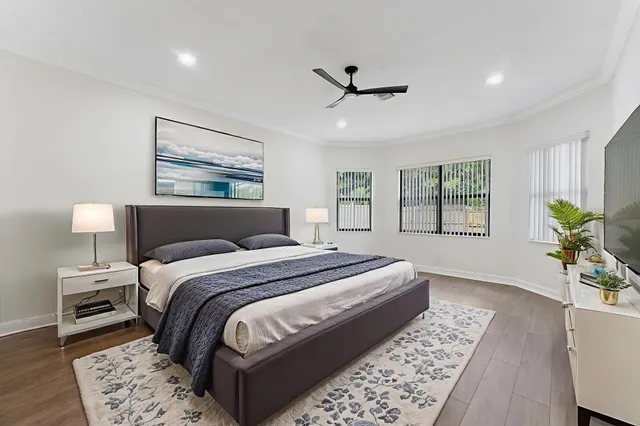 a bedroom with a large bed and a window