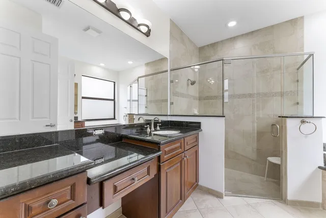 a kitchen that has a sink and a stove in it