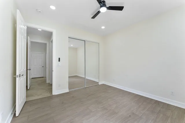 an empty room with wooden floor