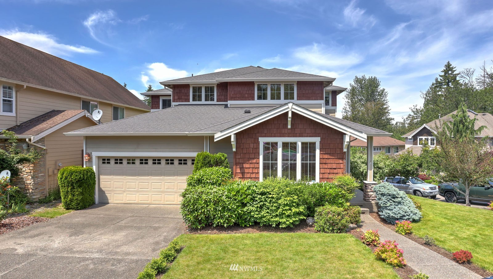 16458 Southeast 166th Terrace Renton, WA 98058 - Photo 1 of 40 a front view of a house with a yard