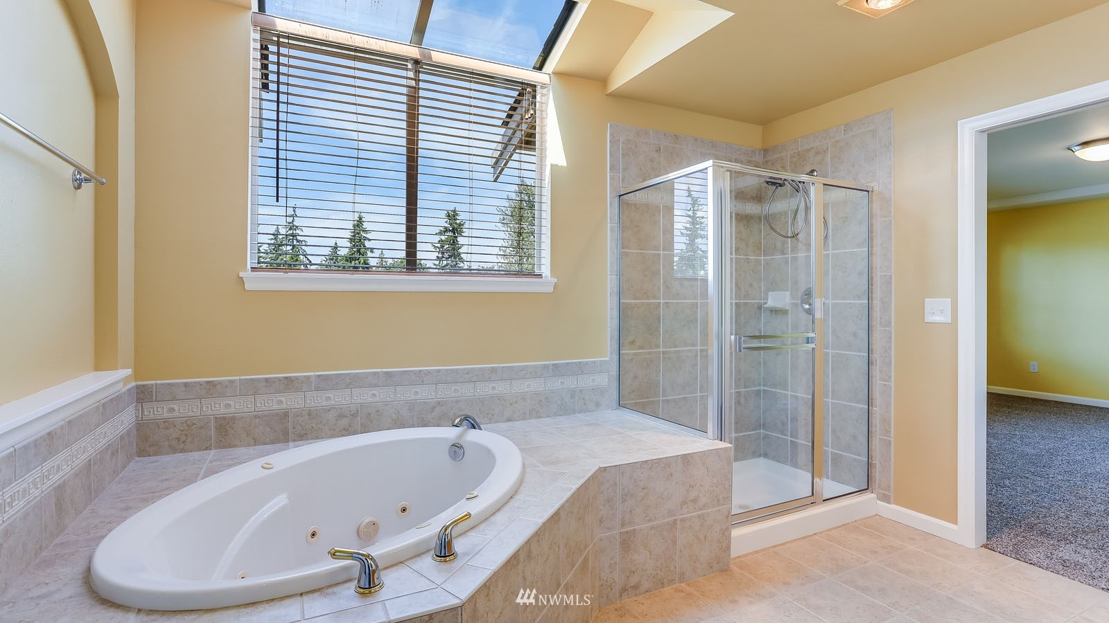 16458 Southeast 166th Terrace Renton, WA 98058 - Photo 32 of 40 a bathroom with a bathtub and a shower