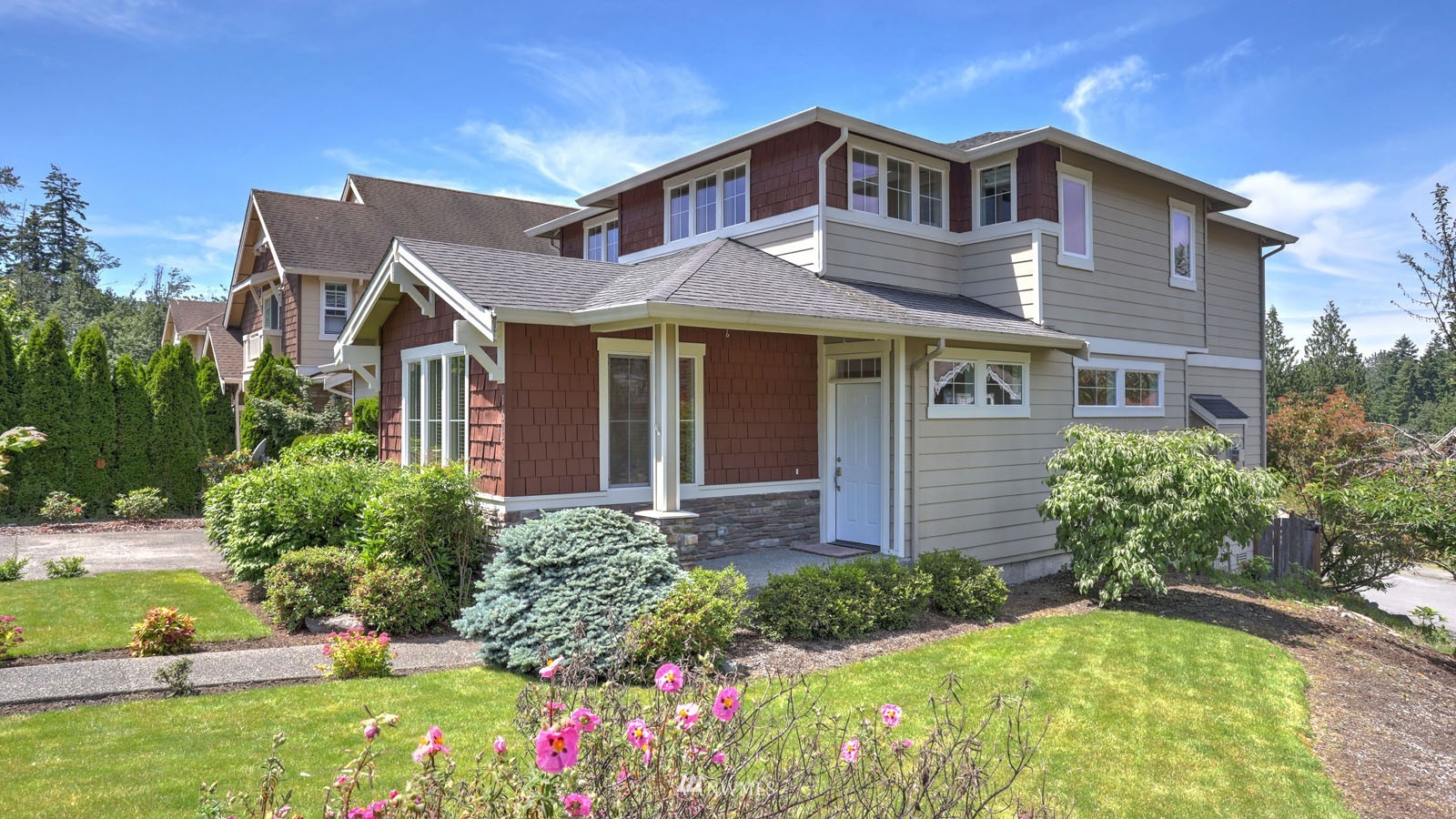 16458 Southeast 166th Terrace Renton, WA 98058 - Photo 4 of 40 a front view of a house with a yard