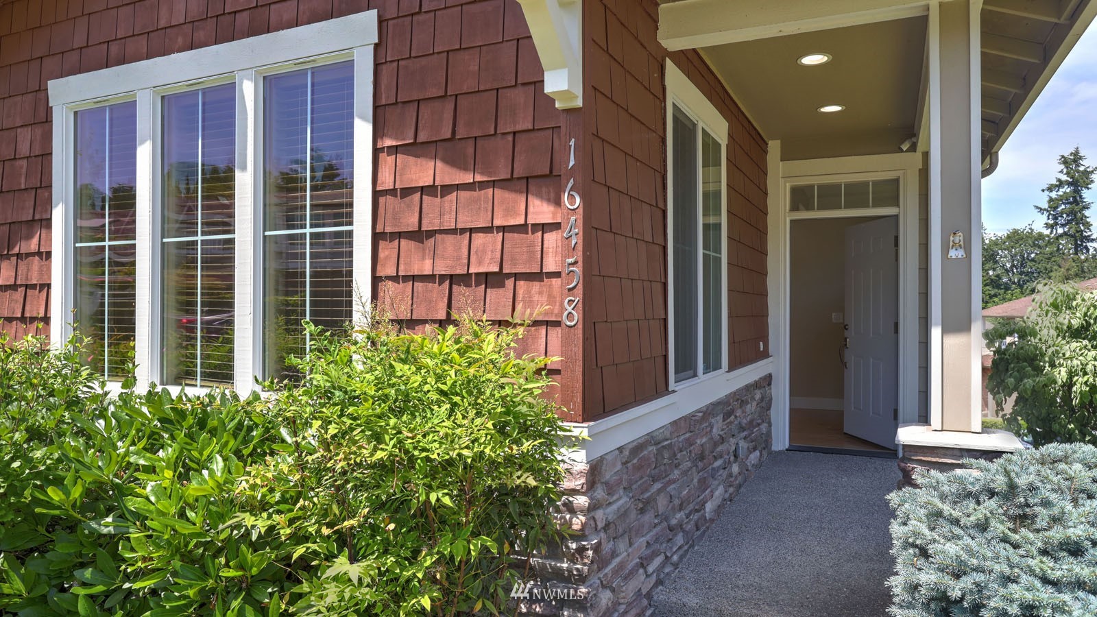 16458 Southeast 166th Terrace Renton, WA 98058 - Photo 5 of 40 front view of a house with a glass windows