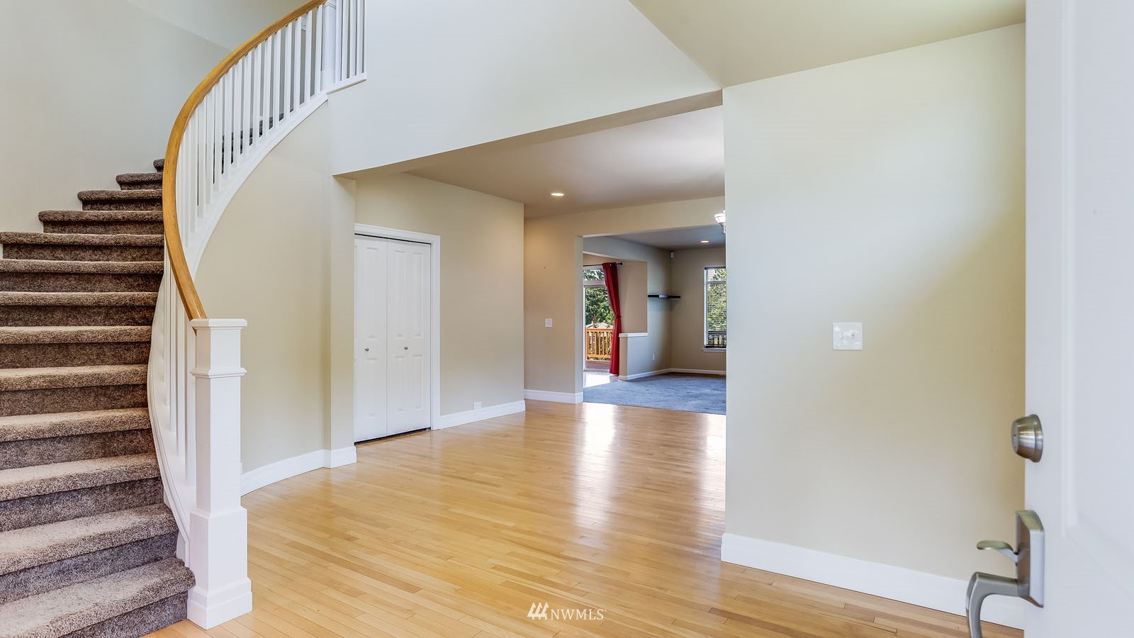 16458 Southeast 166th Terrace Renton, WA 98058 - Photo 6 of 40 a view of a hallway view with wooden floor and entryway