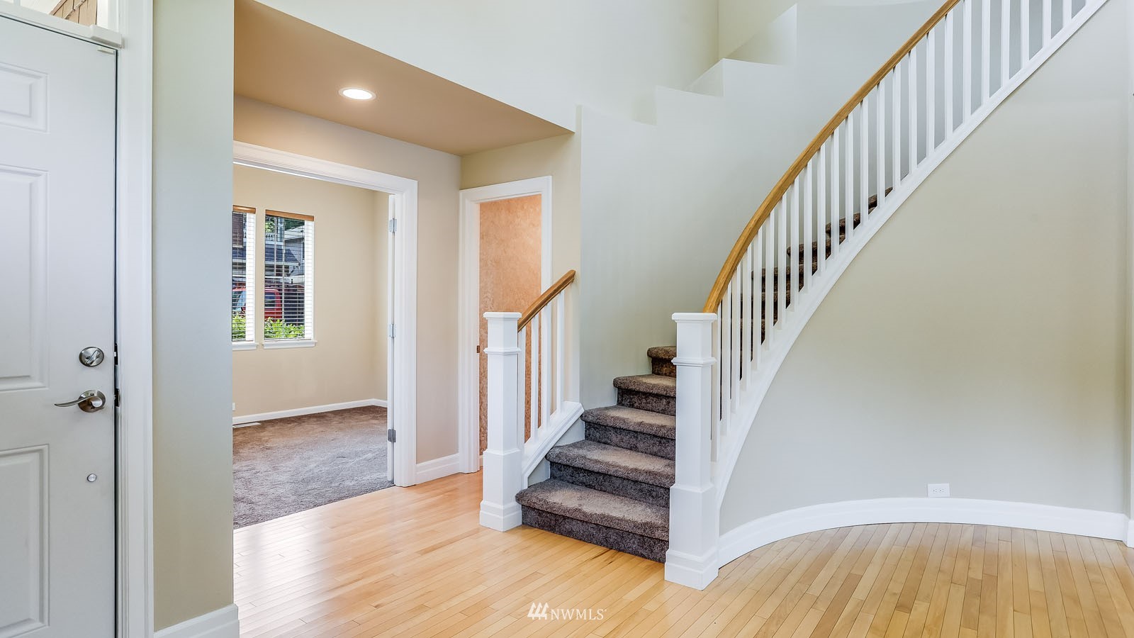 16458 Southeast 166th Terrace Renton, WA 98058 - Photo 7 of 40 a view of entryway and hall with wooden floor