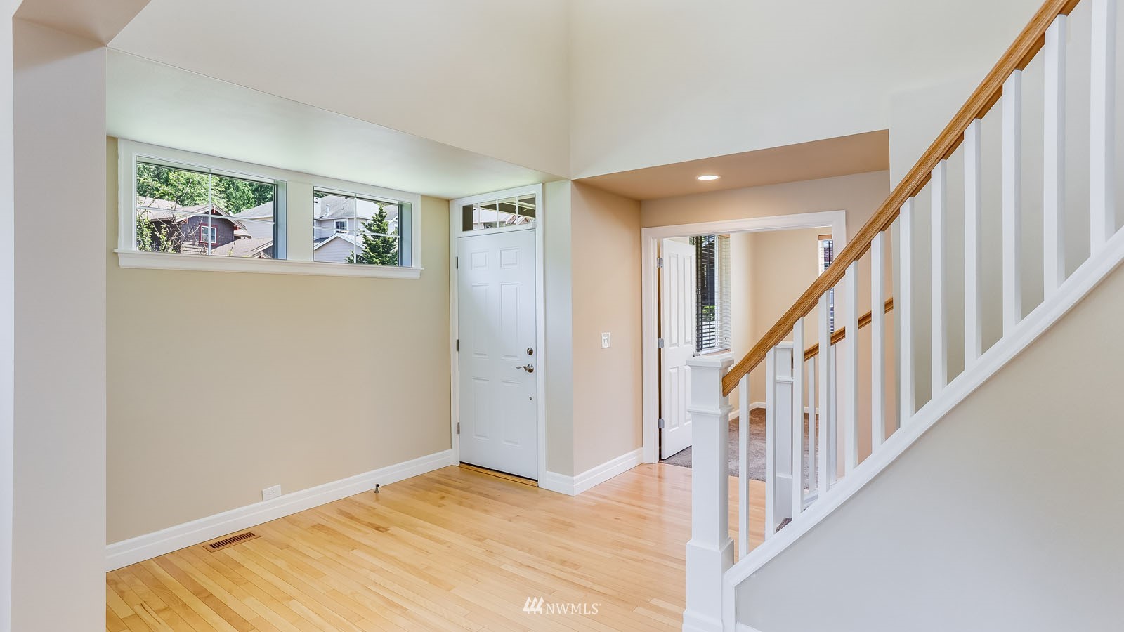 16458 Southeast 166th Terrace Renton, WA 98058 - Photo 8 of 40 a view of an entryway with wooden floor