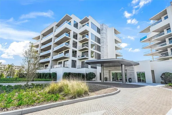 a front view of a building with garden