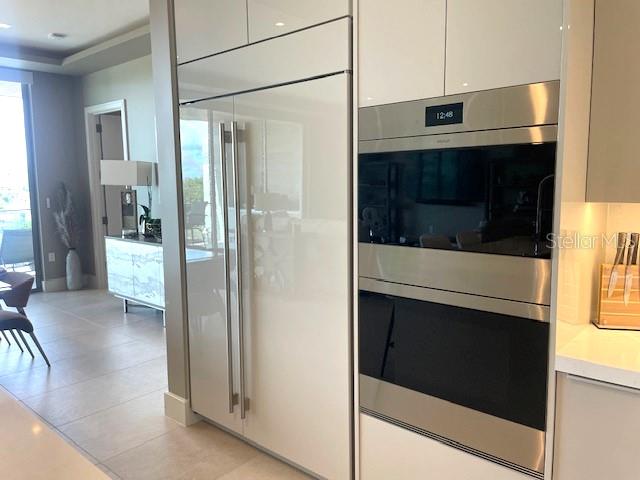 1581 Gulf Of Mexico Drive, Unit 307 Longboat Key, FL 34228 - Photo 13 of 83 a bathroom with a double vanity and a glass door