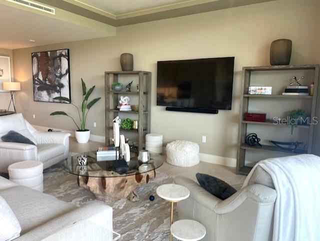 1581 Gulf Of Mexico Drive, Unit 307 Longboat Key, FL 34228 - Photo 19 of 83 a living room with furniture and a flat screen tv