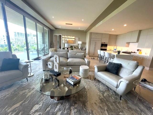 1581 Gulf Of Mexico Drive, Unit 307 Longboat Key, FL 34228 - Photo 22 of 83 a living room with furniture and a large window