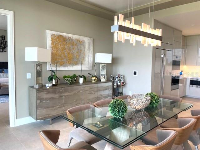 1581 Gulf Of Mexico Drive, Unit 307 Longboat Key, FL 34228 - Photo 24 of 83 a living room with furniture and a potted plant