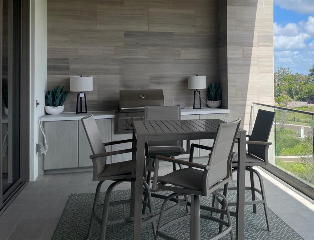 1581 Gulf Of Mexico Drive, Unit 307 Longboat Key, FL 34228 - Photo 35 of 83 a view of a dining room with furniture and window