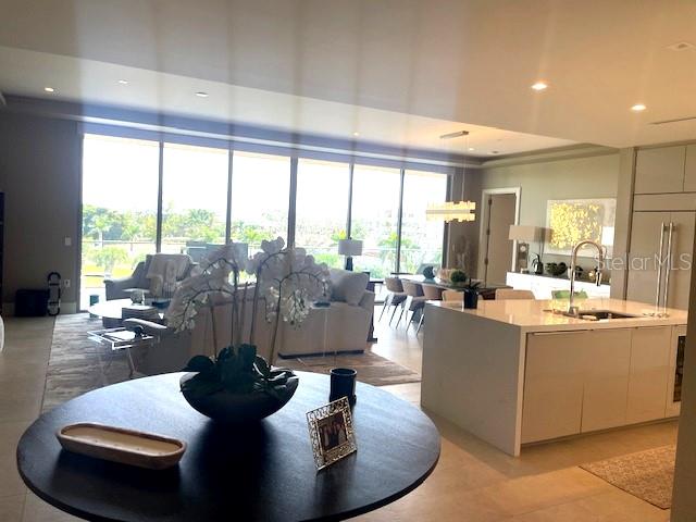 1581 Gulf Of Mexico Drive, Unit 307 Longboat Key, FL 34228 - Photo 4 of 83 a living room with furniture and a large window