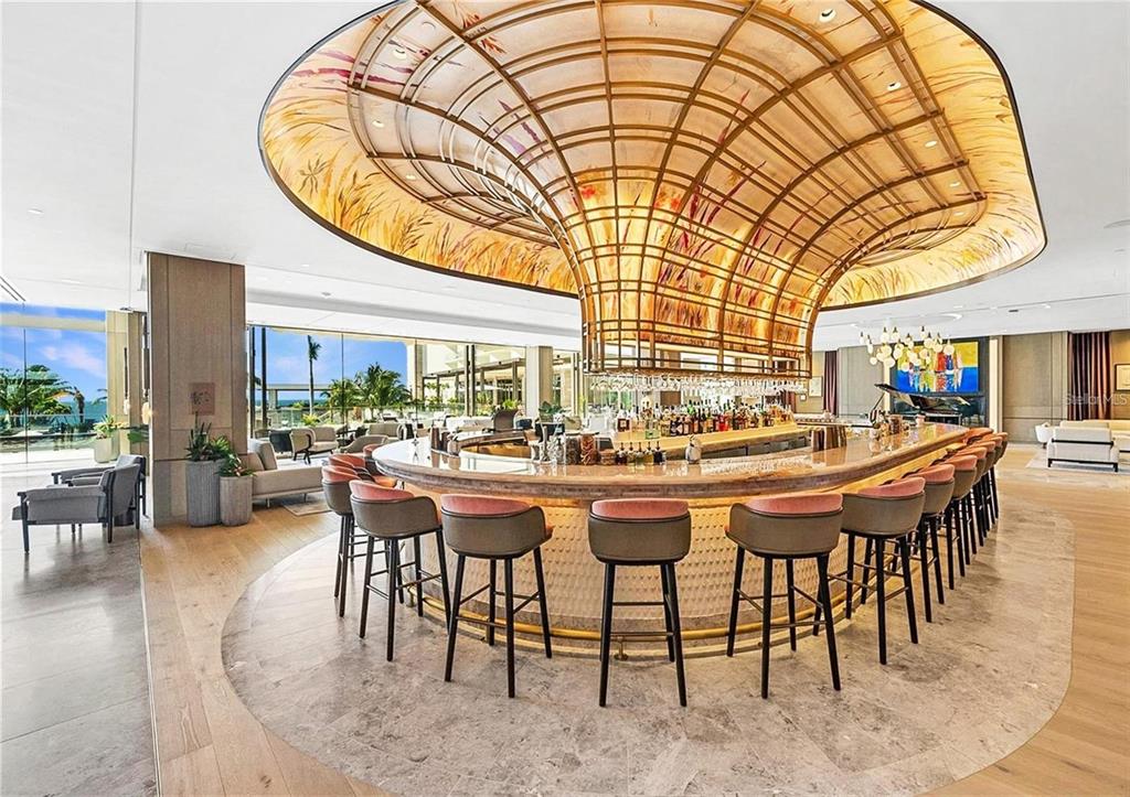 1581 Gulf Of Mexico Drive, Unit 307 Longboat Key, FL 34228 - Photo 71 of 83 a view of a dining room with furniture window and wooden floor
