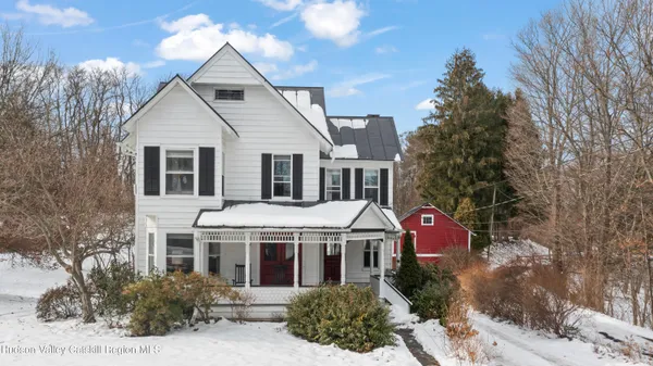 a aerial view of a house with a yard