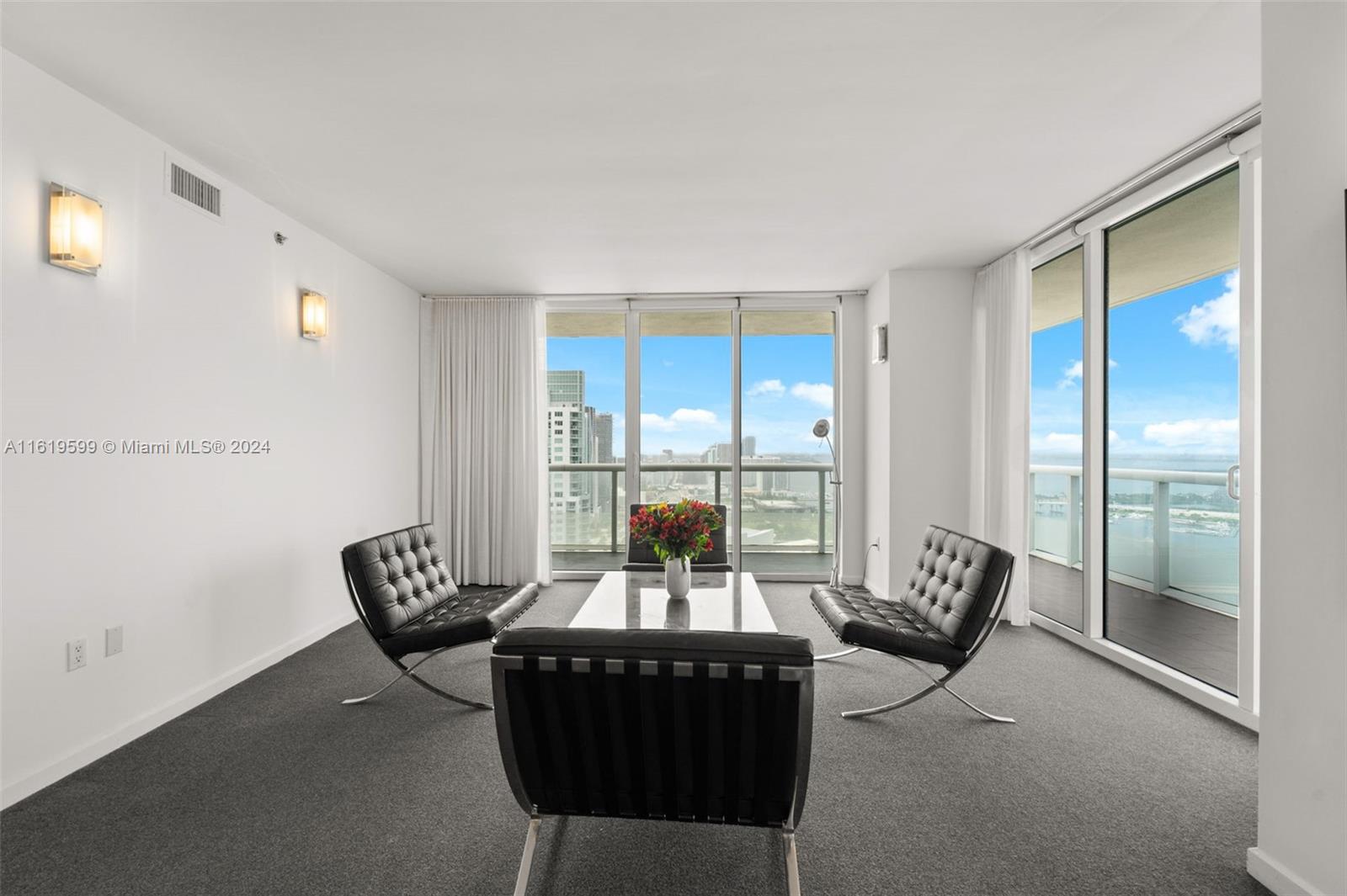 50 Biscayne Boulevard, Unit 4802 Miami, FL 33132 - Photo 9 of 27 a living room with furniture