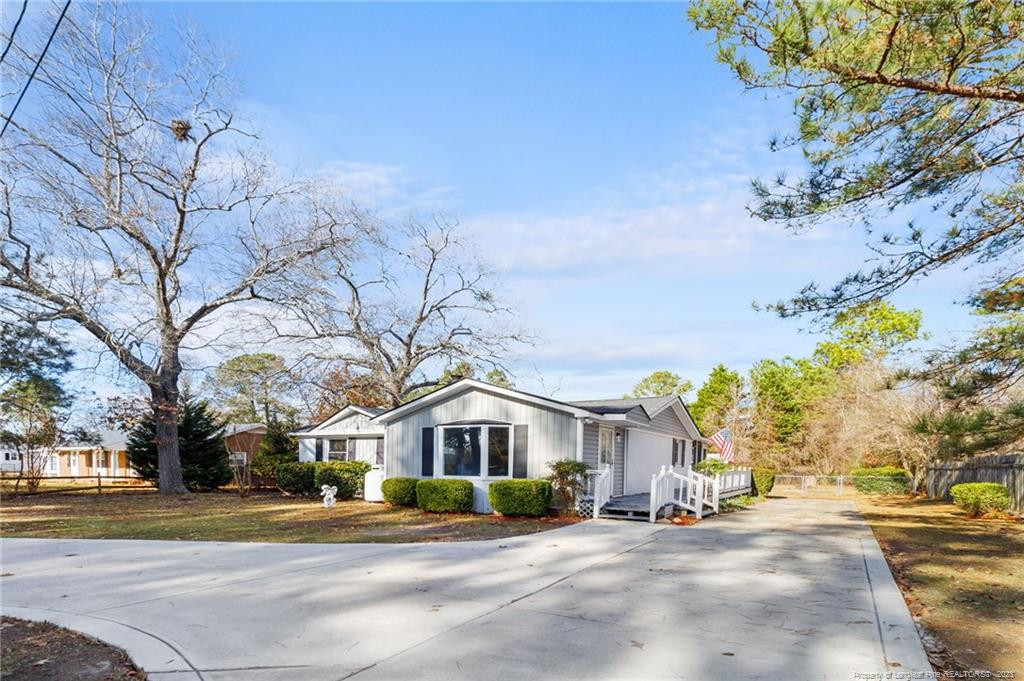 8424 King Road Fayetteville, NC 28306 - Photo 1 of 35 a view of a building with a lot of trees