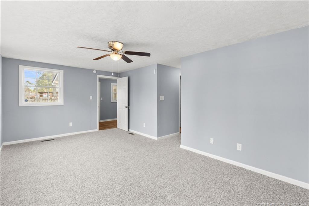 8424 King Road Fayetteville, NC 28306 - Photo 16 of 35 a view of an empty room with a ceiling fan
