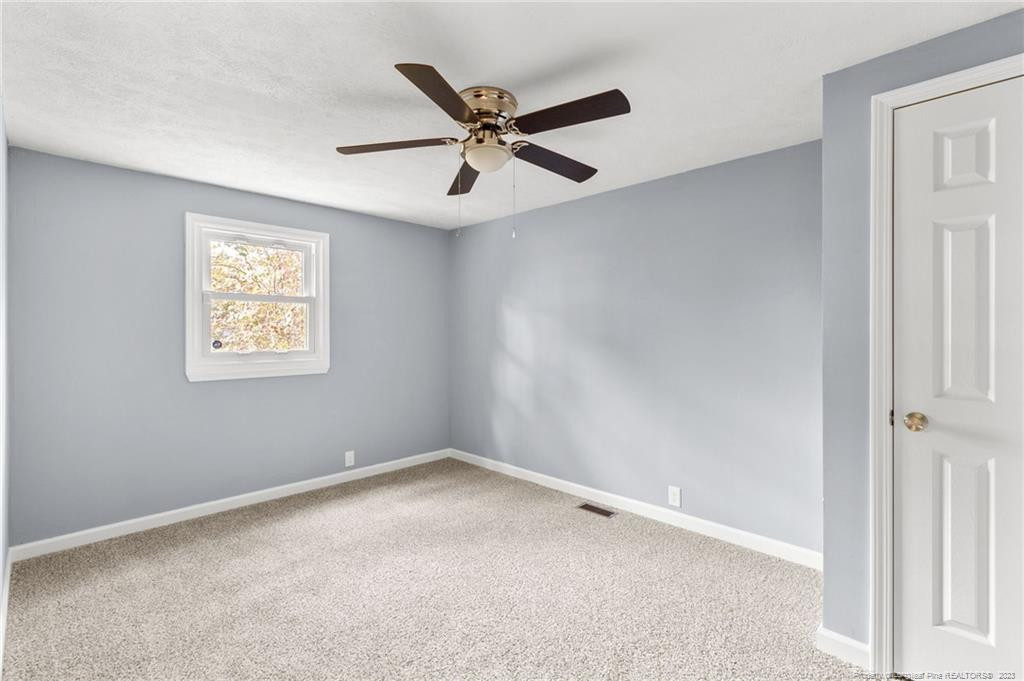 8424 King Road Fayetteville, NC 28306 - Photo 24 of 35 a view of an empty room with a ceiling fan