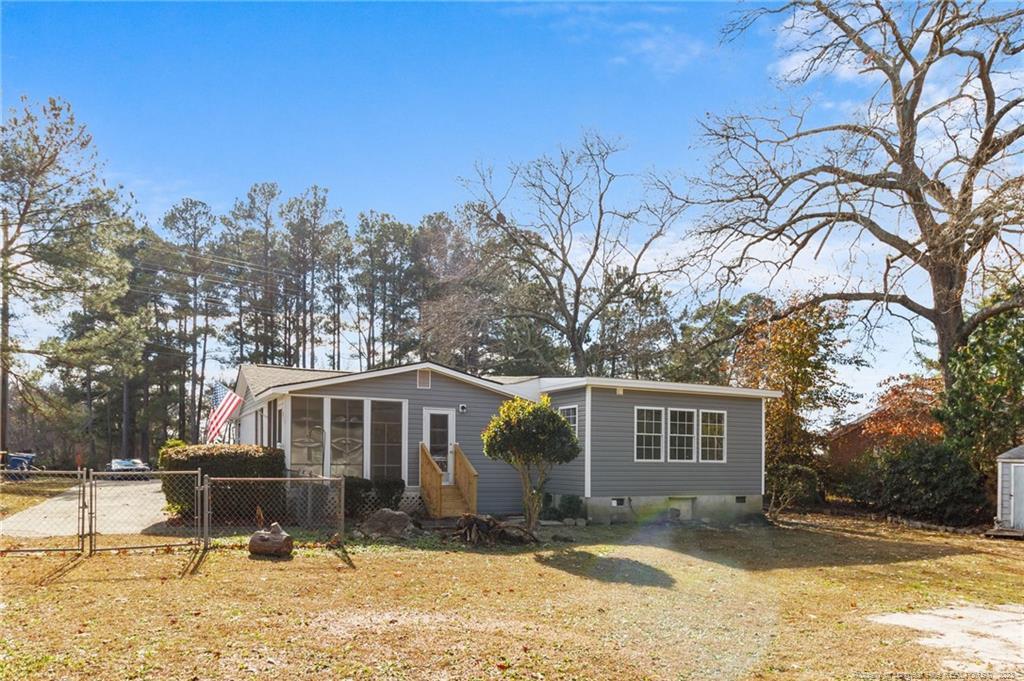 8424 King Road Fayetteville, NC 28306 - Photo 33 of 35 a front view of a house with a yard