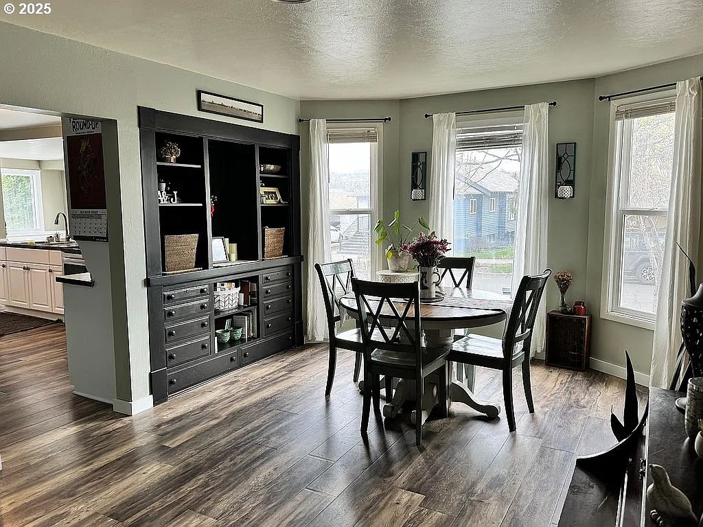 204 Northwest 6th Street Pendleton, OR 97801 - Photo 5 of 14 a view of a dining room with furniture and wooden floor