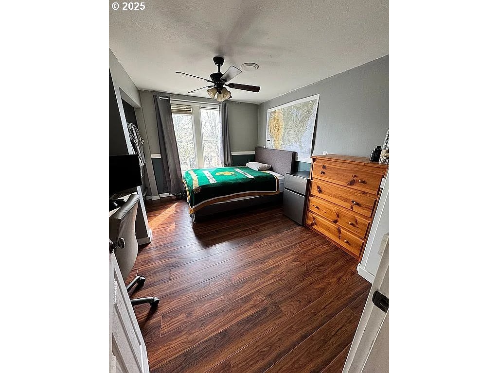 204 Northwest 6th Street Pendleton, OR 97801 - Photo 8 of 14 a living room with furniture and a flat screen tv
