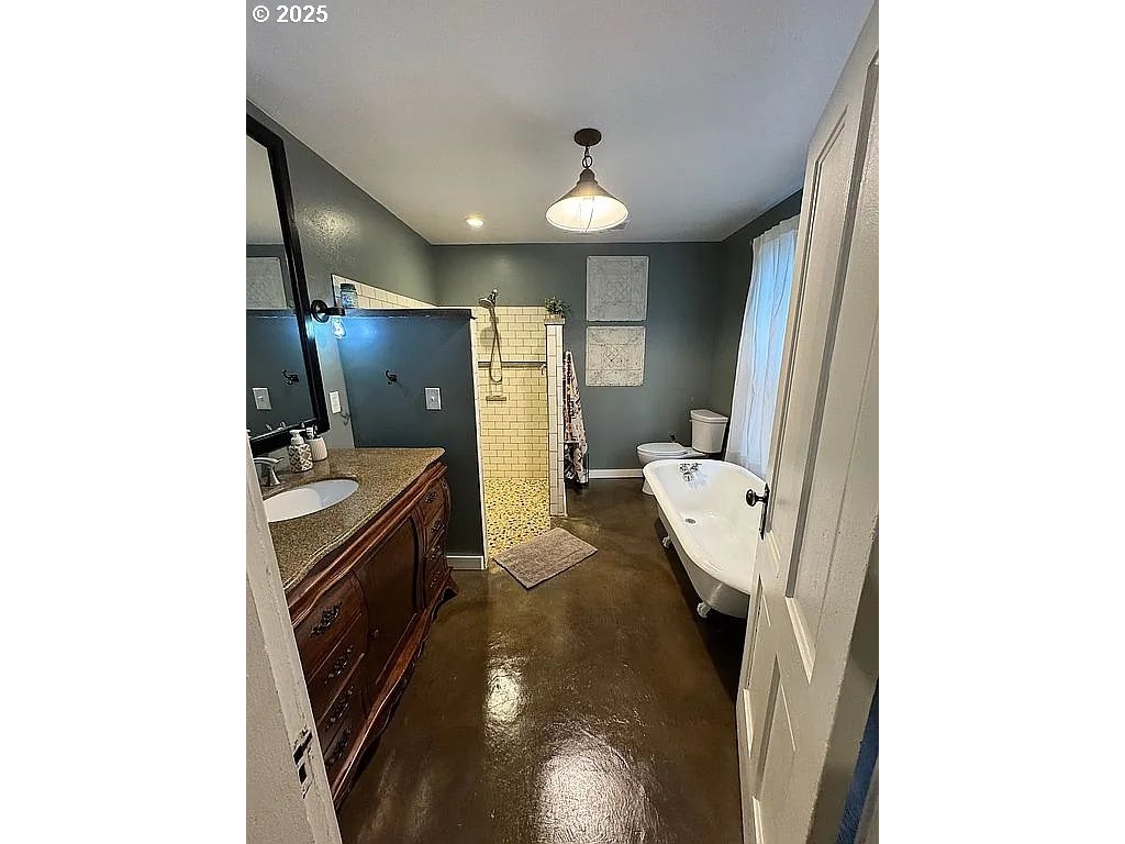 204 Northwest 6th Street Pendleton, OR 97801 - Photo 10 of 14 a bathroom with a sink and mirror