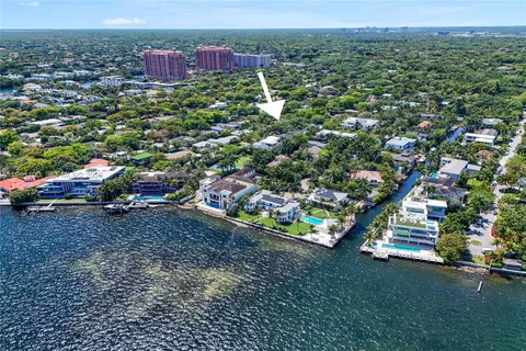 an aerial view of residential houses with outdoor space and street view