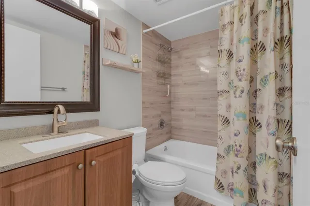 a bathroom with a sink a toilet and a bathtub