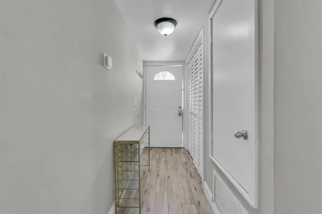 a view of gallery with wooden floor