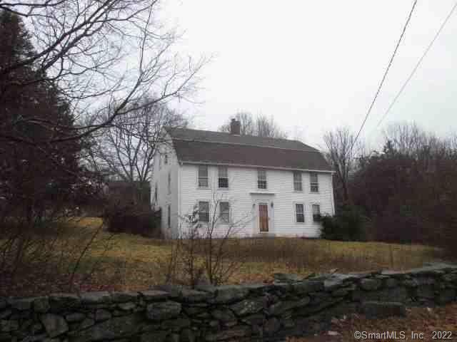 146 Stone Hill Road Griswold, CT 06351 - Photo 1 of 1 a view of a white house next to a yard with large trees