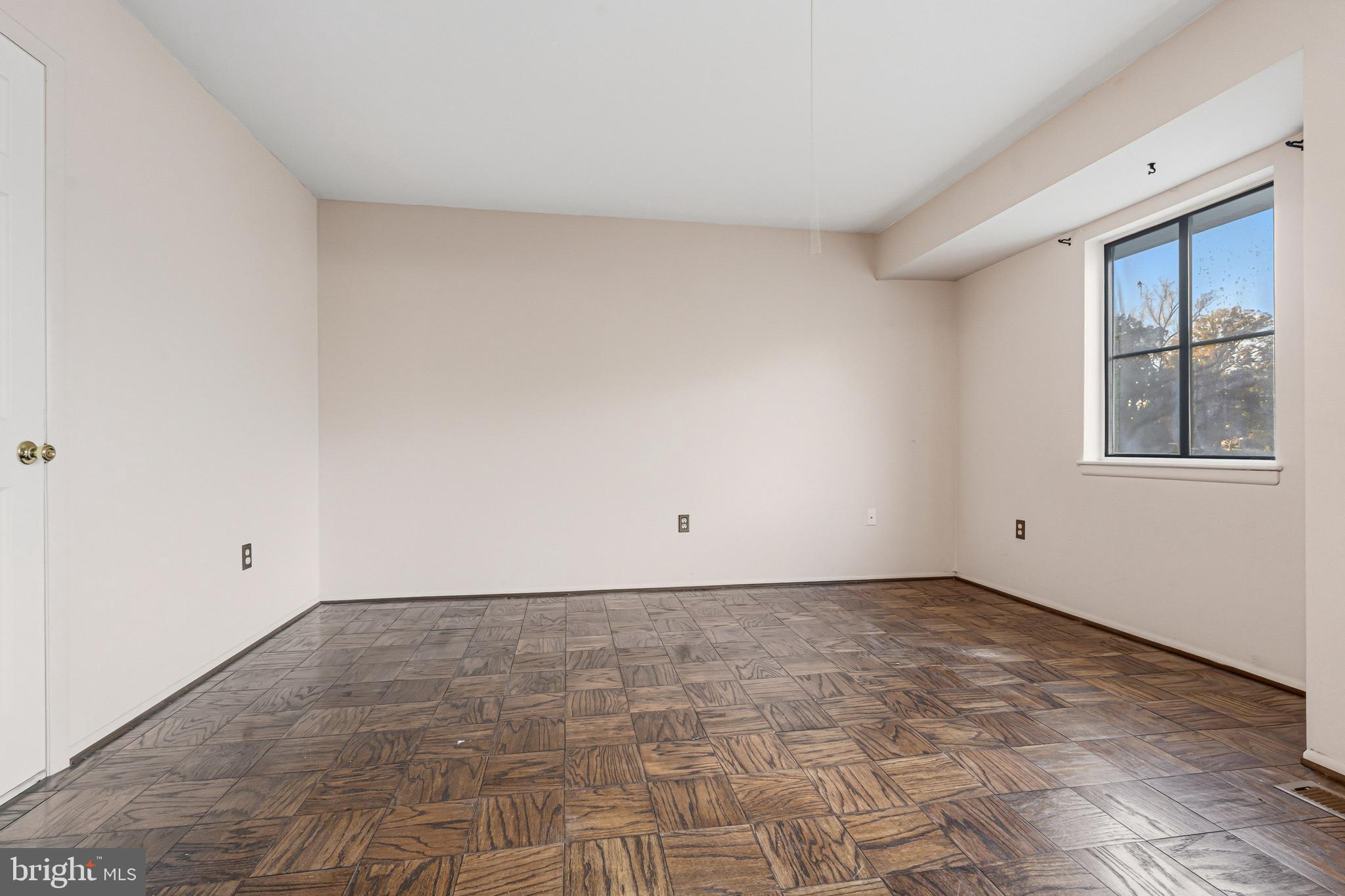 6 Stone Ridge Court, Unit 29 Baltimore, MD 21239 - Photo 17 of 26 a view of an empty room with a window
