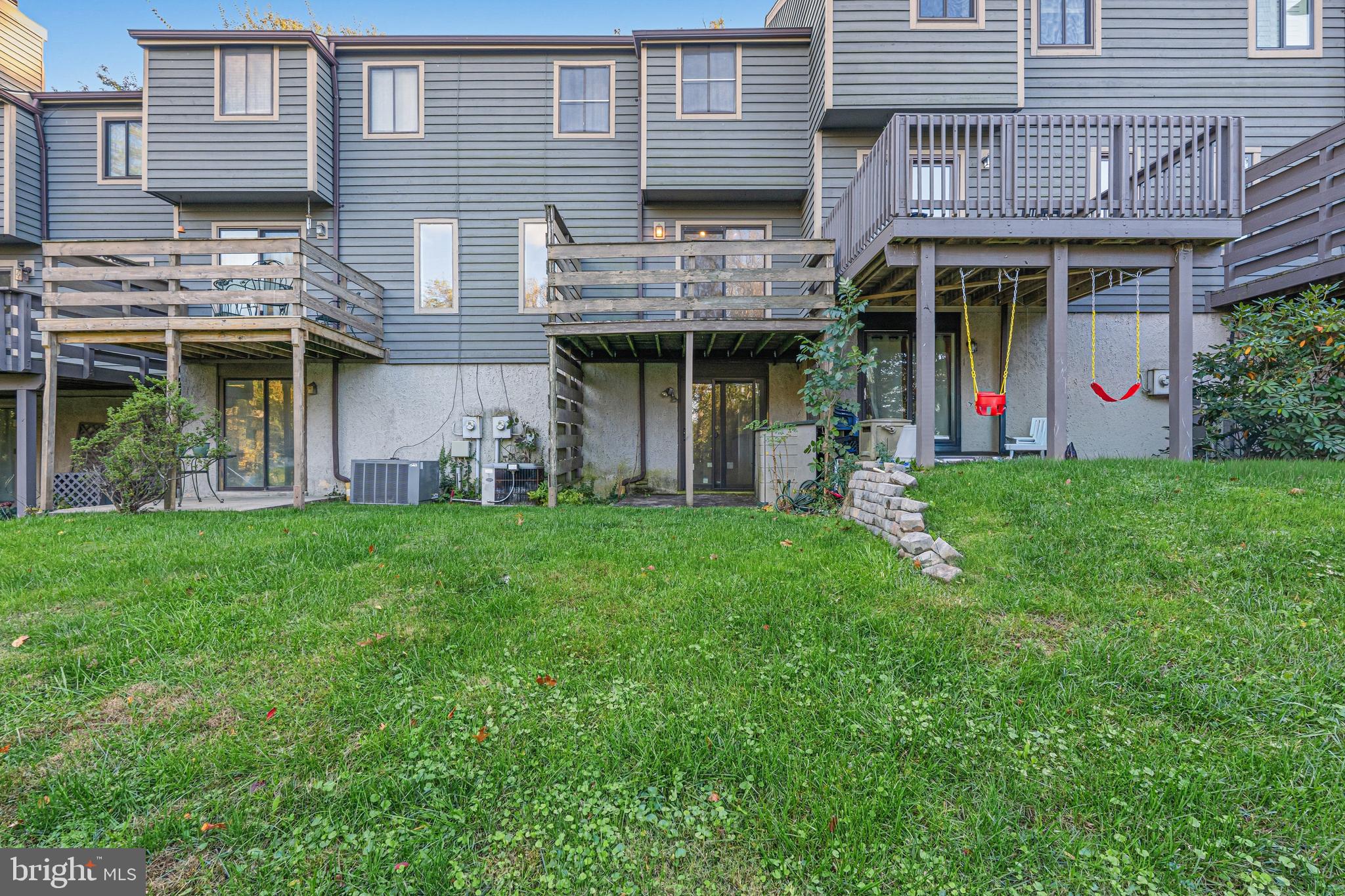 6 Stone Ridge Court, Unit 29 Baltimore, MD 21239 - Photo 20 of 26 a view of a chairs and table in front of a house