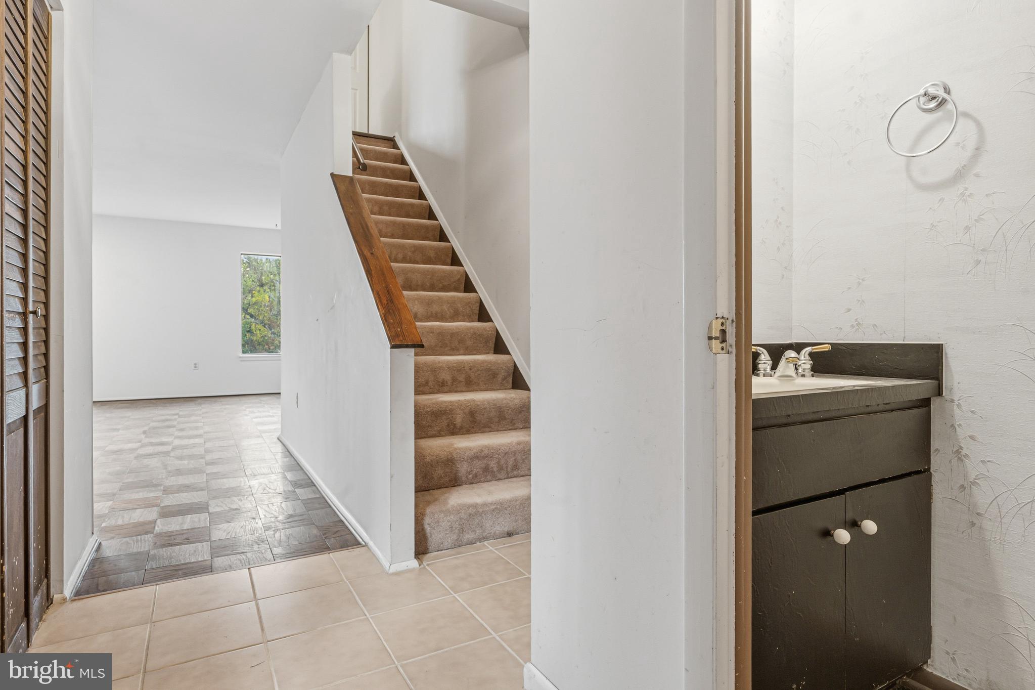 6 Stone Ridge Court, Unit 29 Baltimore, MD 21239 - Photo 5 of 26 a view of an entryway with wooden floor