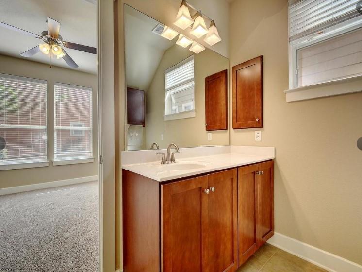 1601 Miriam Avenue, Unit 203 Austin, TX 78702 - Photo 23 of 29 a bathroom with a sink a vanity and a mirror