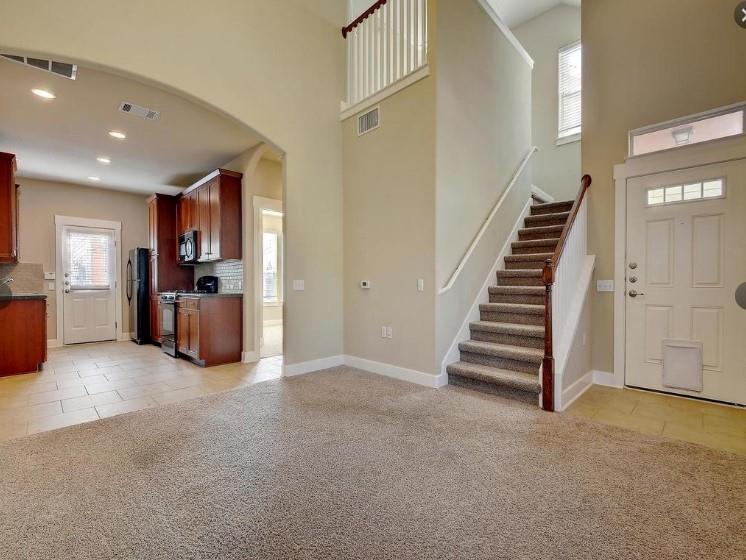 1601 Miriam Avenue, Unit 203 Austin, TX 78702 - Photo 4 of 29 a view of a kitchen with furniture and stairs