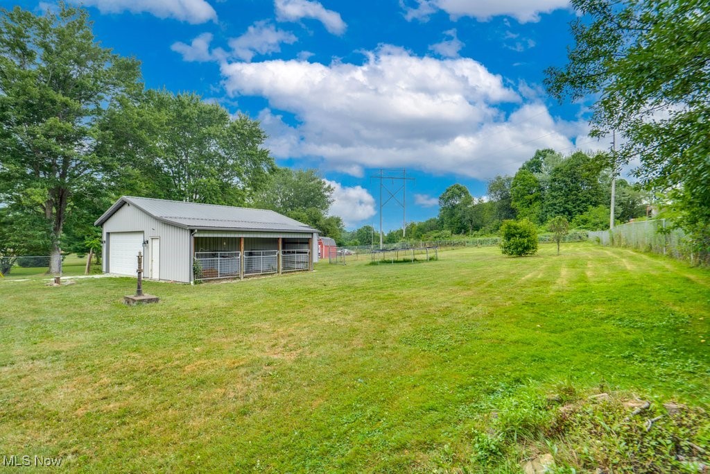 3362 Sunnybrook Road Kent, OH 44240 - Photo 40 of 50 View of yard featuring an outdoor structure, a garage, and a pole building
