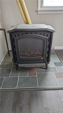 a stove top oven sitting inside of a kitchen