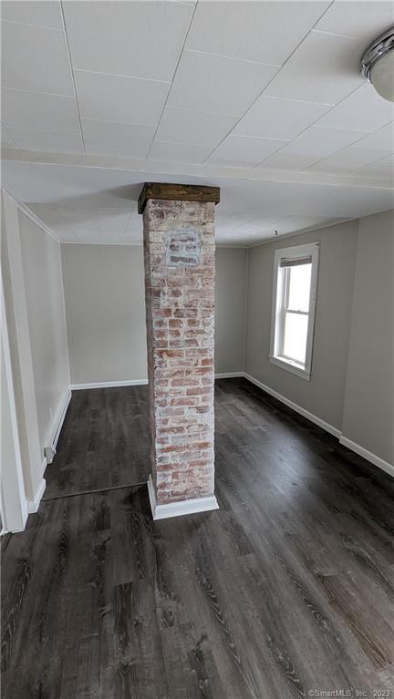 134 Bristol Street, Unit 2 Southington, CT 06489 - Photo 9 of 12 an empty room with wooden floor and windows