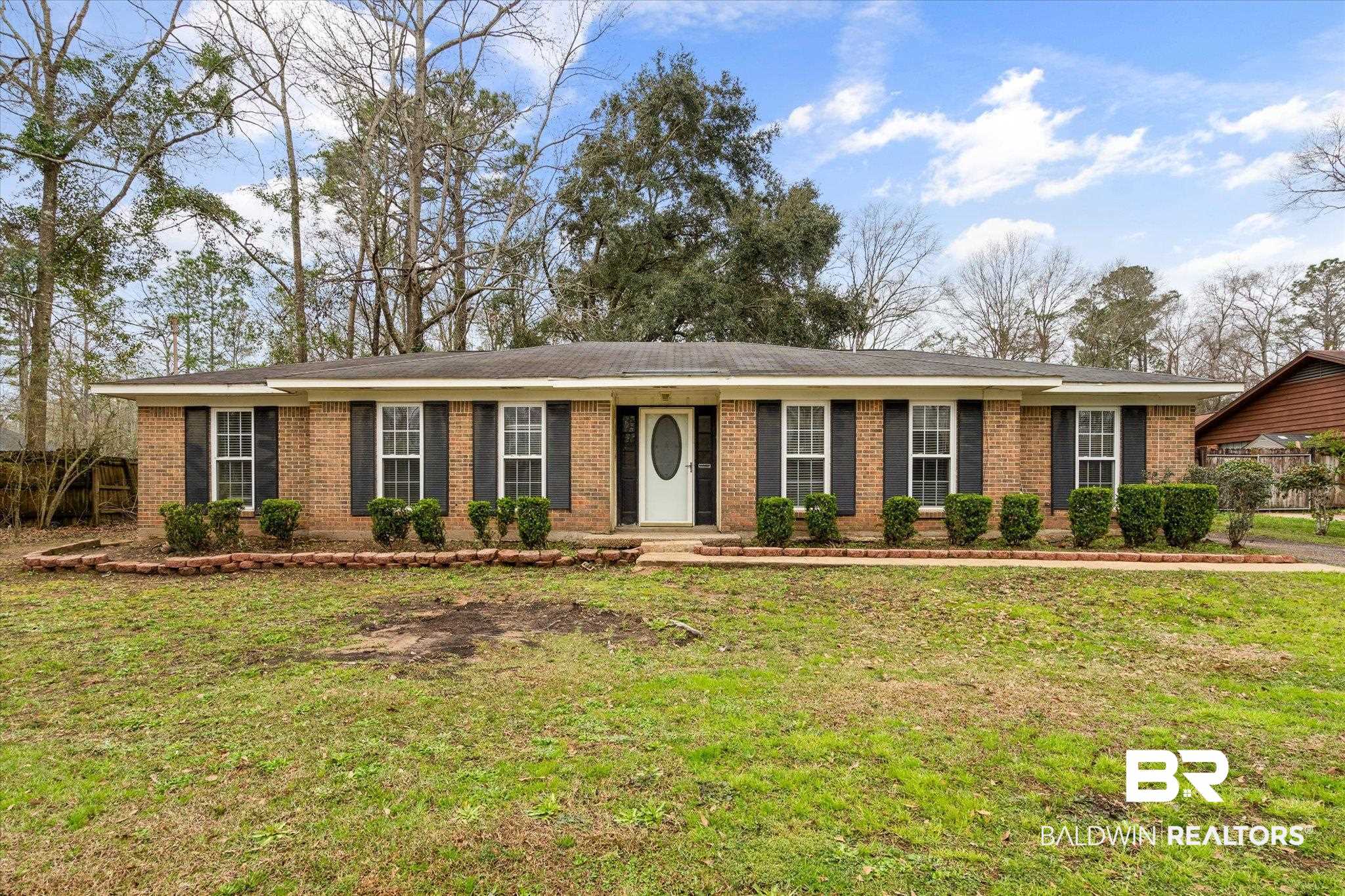 3541 Winston Drive Semmes, AL 36575 - Photo 1 of 20 Single story home with brick siding, fence, and a front lawn
