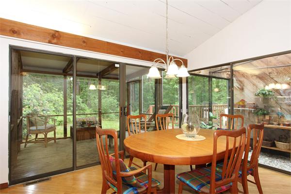 6 White Road Wayland, MA 01778 - Photo 5 of 24 a dining room with furniture wooden floor and a chandelier