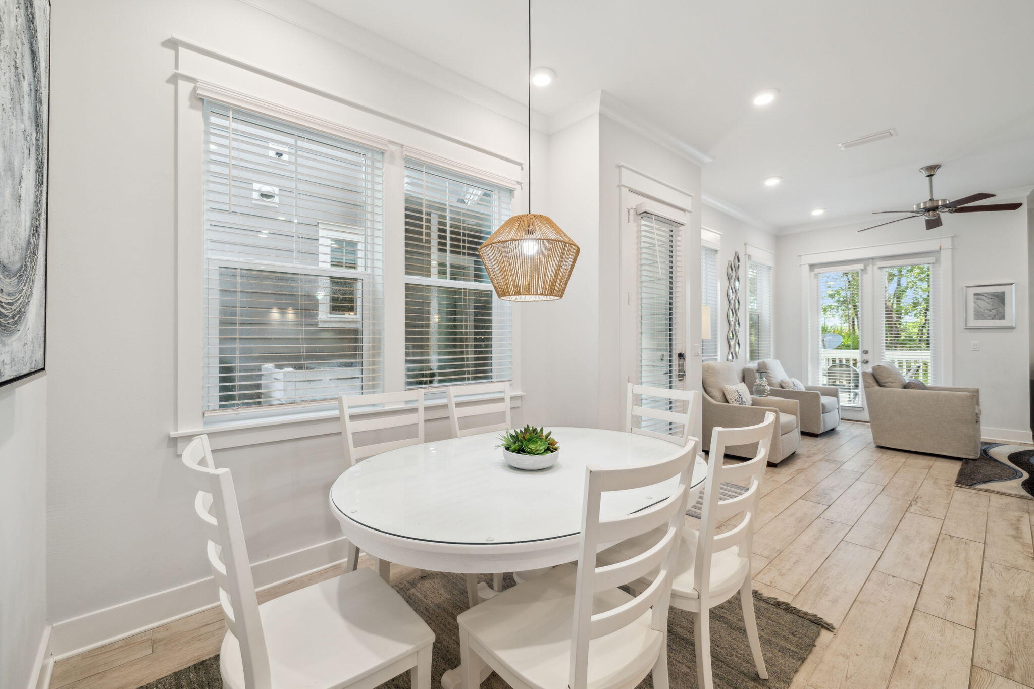 309 Milestone Dr Inlet Beach, Unit A Inlet Beach, FL 32461 - Photo 17 of 54 a dining room with furniture wooden floor and a chandelier