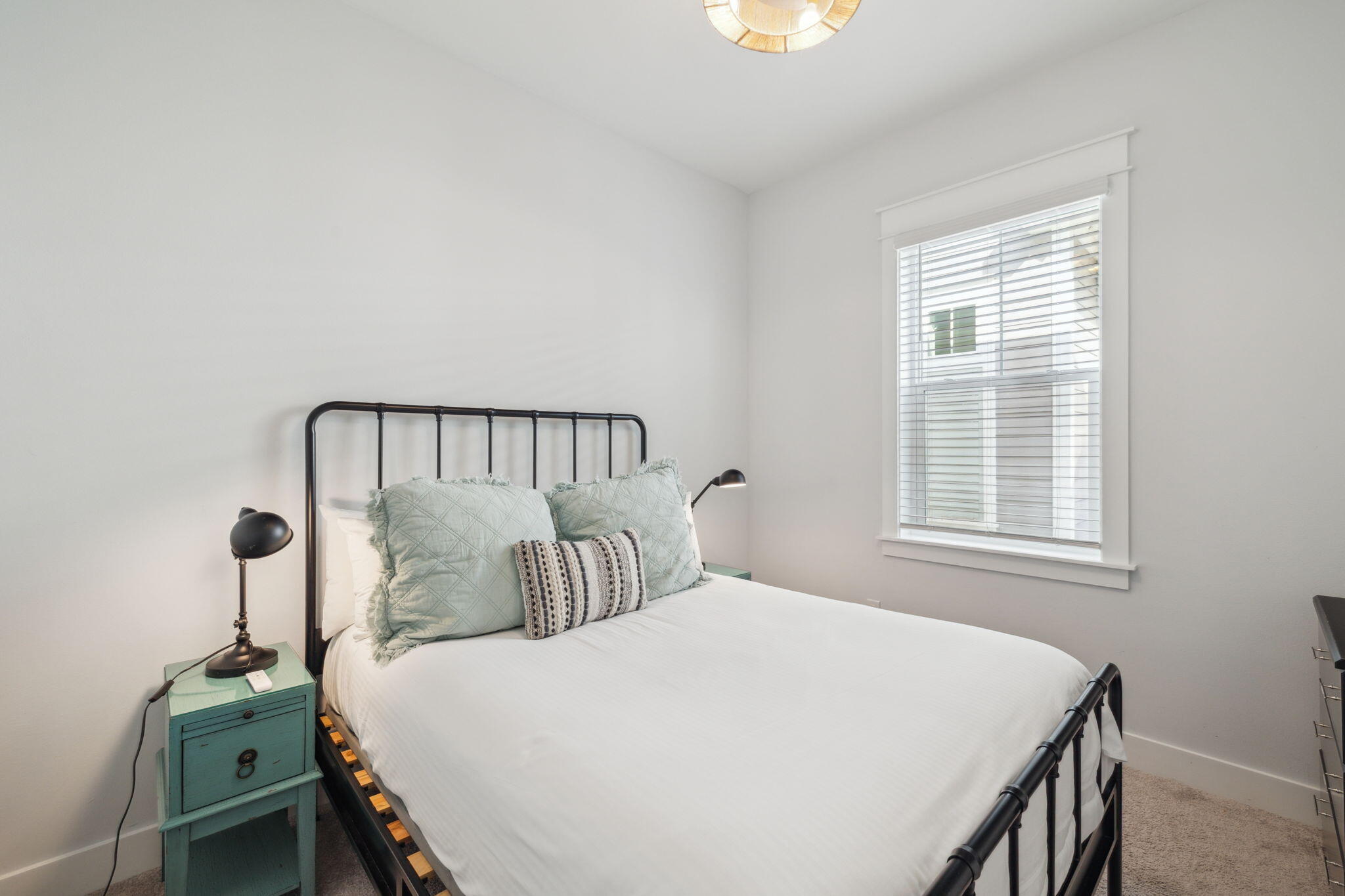 309 Milestone Dr Inlet Beach, Unit A Inlet Beach, FL 32461 - Photo 20 of 54 a bedroom with a bed and a window