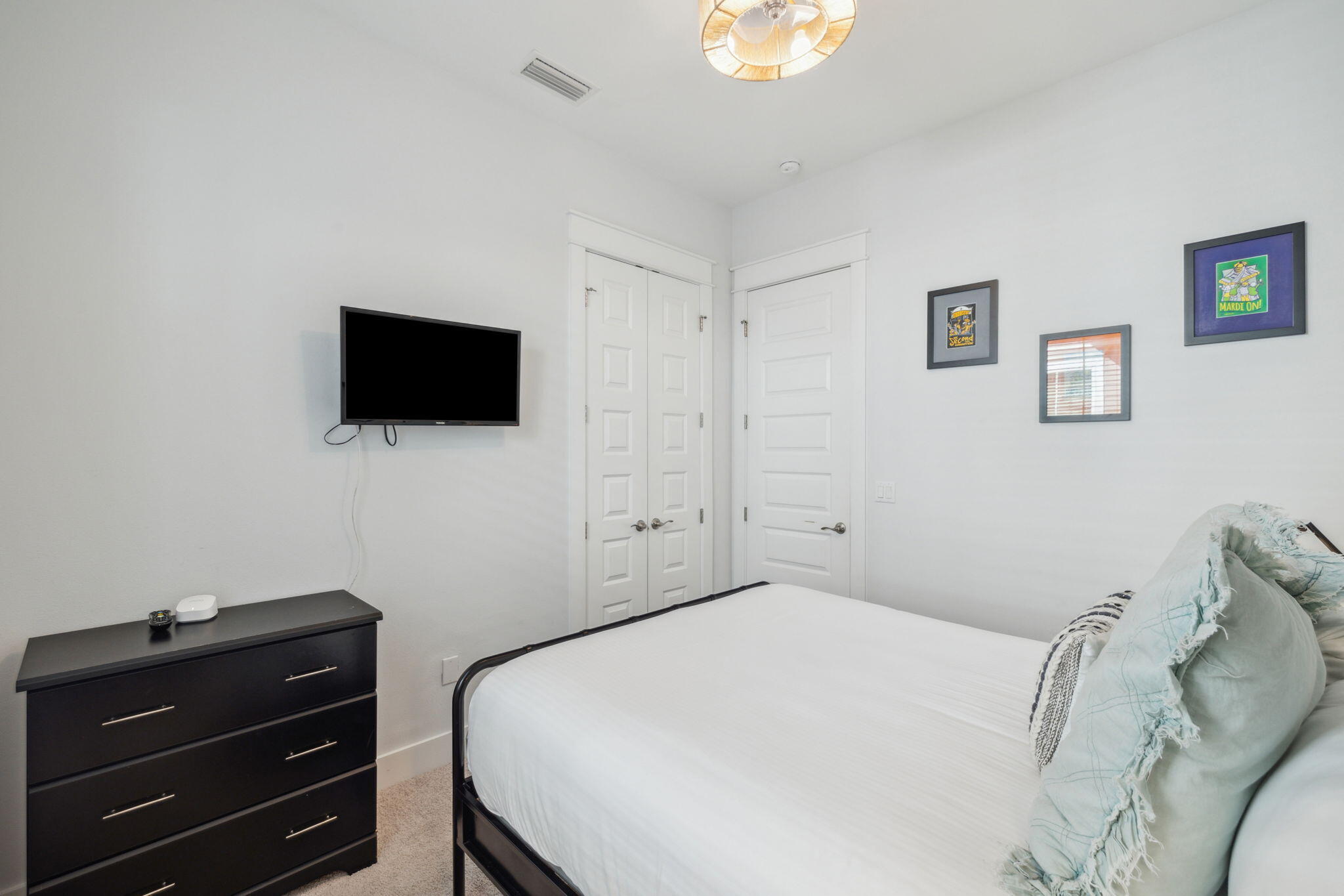 309 Milestone Dr Inlet Beach, Unit A Inlet Beach, FL 32461 - Photo 21 of 54 a bedroom with a bed and a flat screen tv