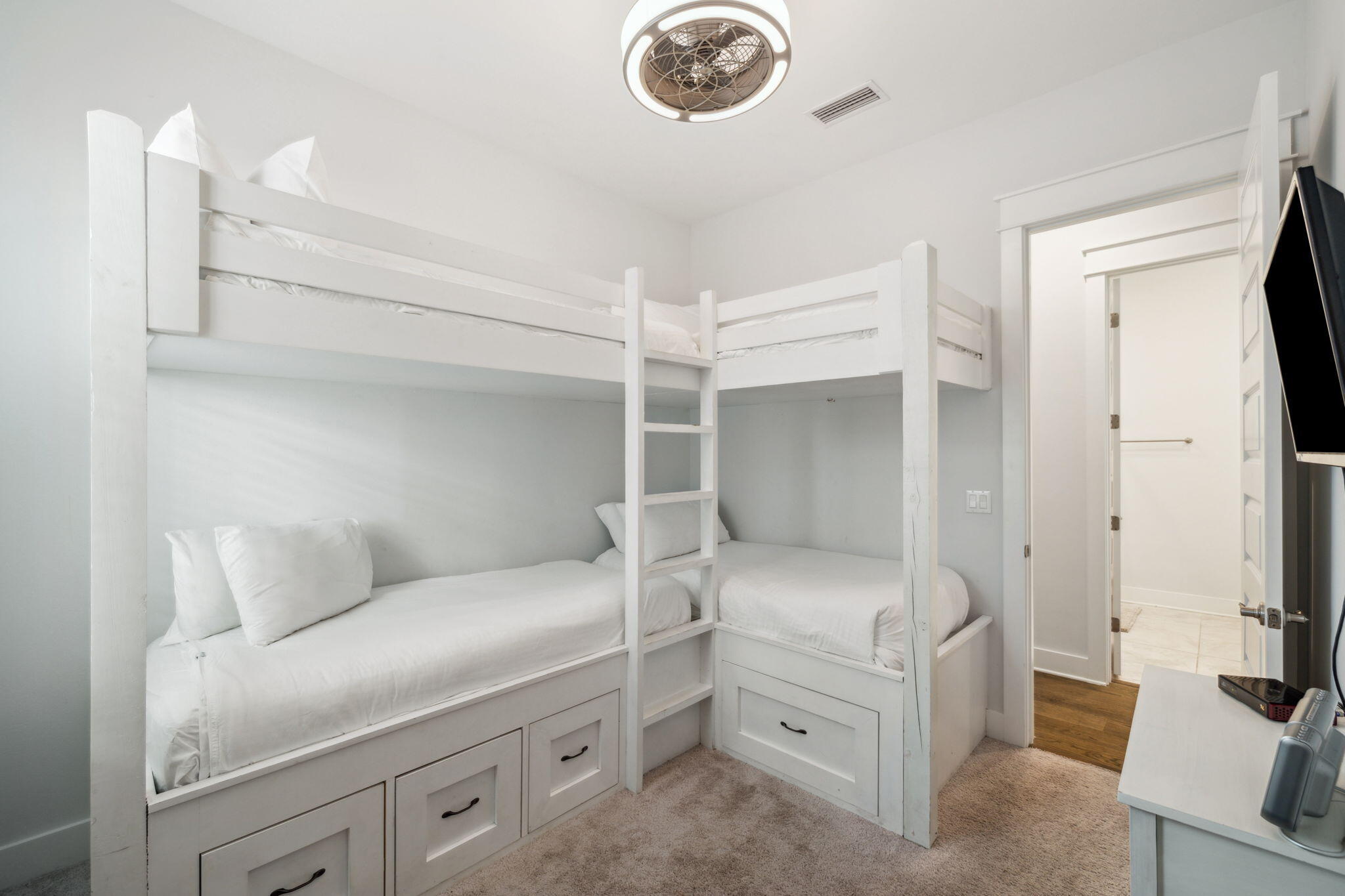 309 Milestone Dr Inlet Beach, Unit A Inlet Beach, FL 32461 - Photo 23 of 54 a bedroom with a bed and a chandelier