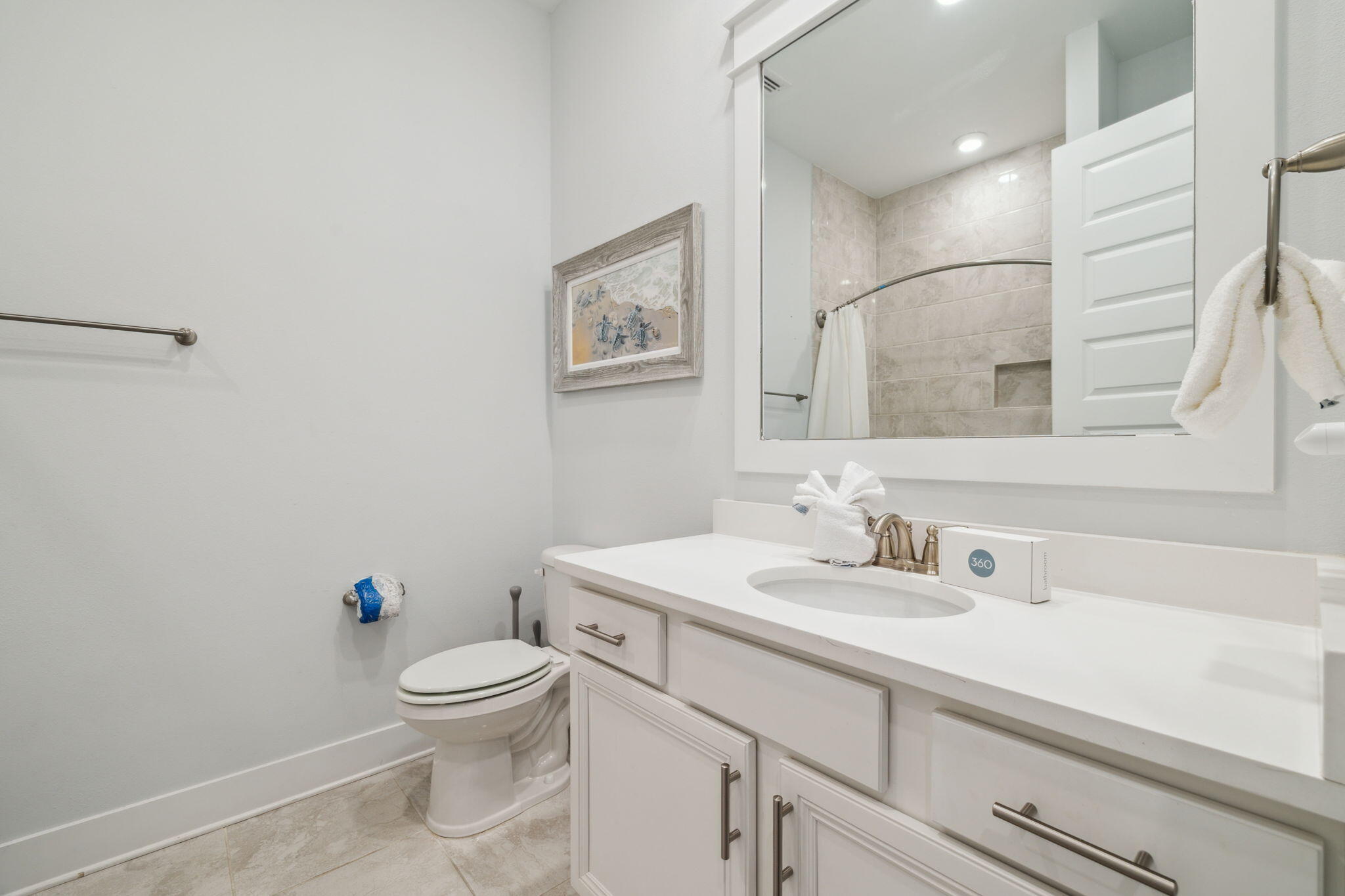 309 Milestone Dr Inlet Beach, Unit A Inlet Beach, FL 32461 - Photo 24 of 54 a bathroom with a sink a toilet and a mirror
