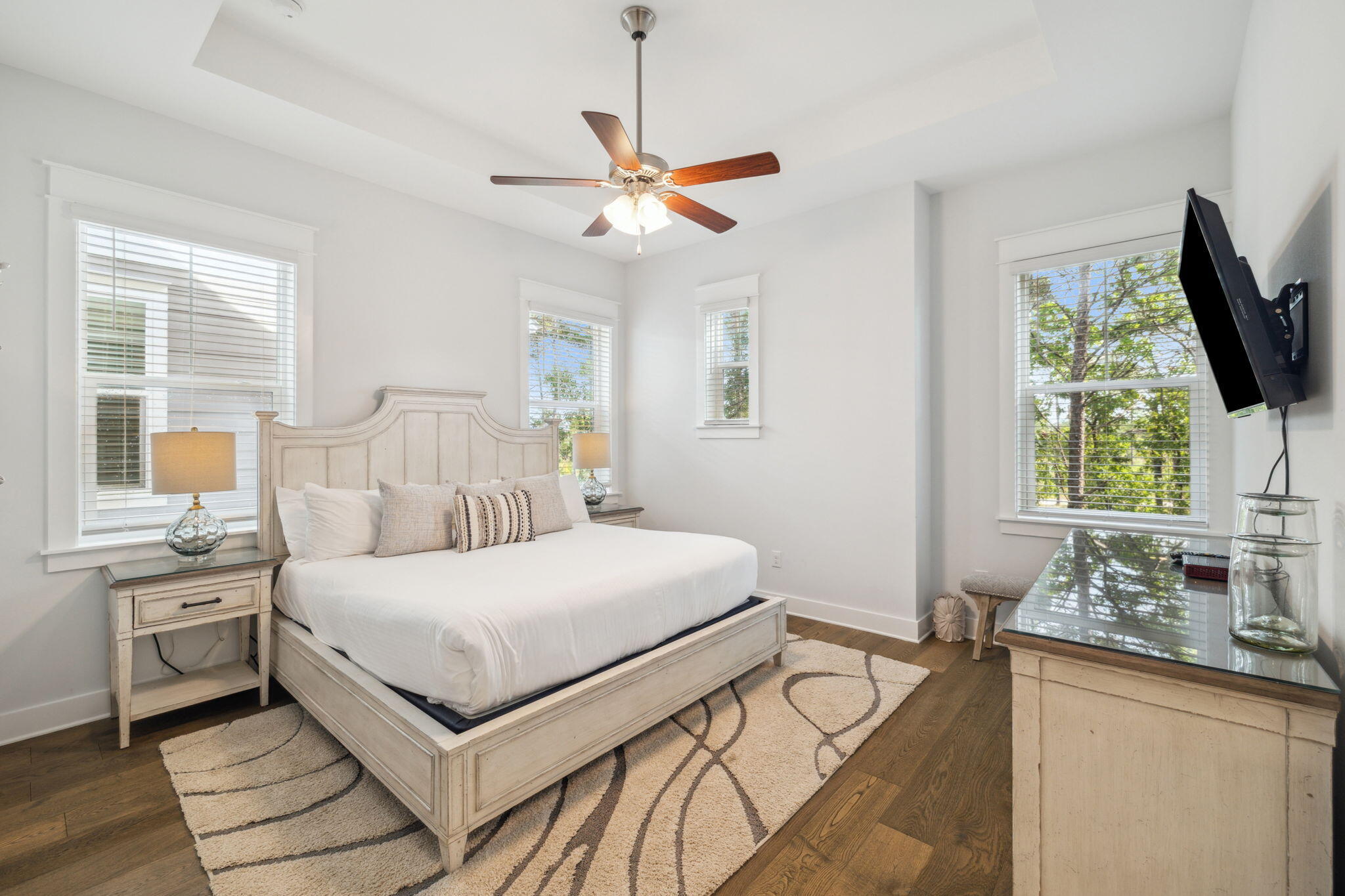 309 Milestone Dr Inlet Beach, Unit A Inlet Beach, FL 32461 - Photo 26 of 54 a bedroom with a large bed and a flat tv screen on dresser