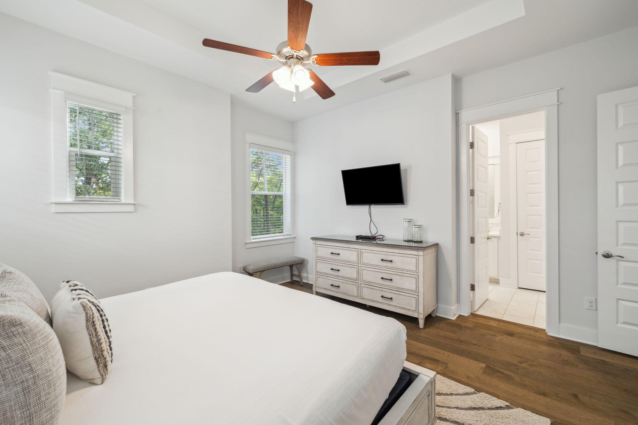 309 Milestone Dr Inlet Beach, Unit A Inlet Beach, FL 32461 - Photo 27 of 54 a bedroom with a bed and a flat screen tv